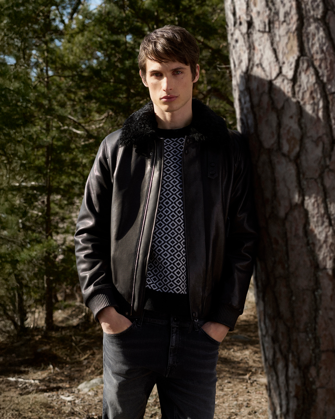 Man in leather jacket with a sweater